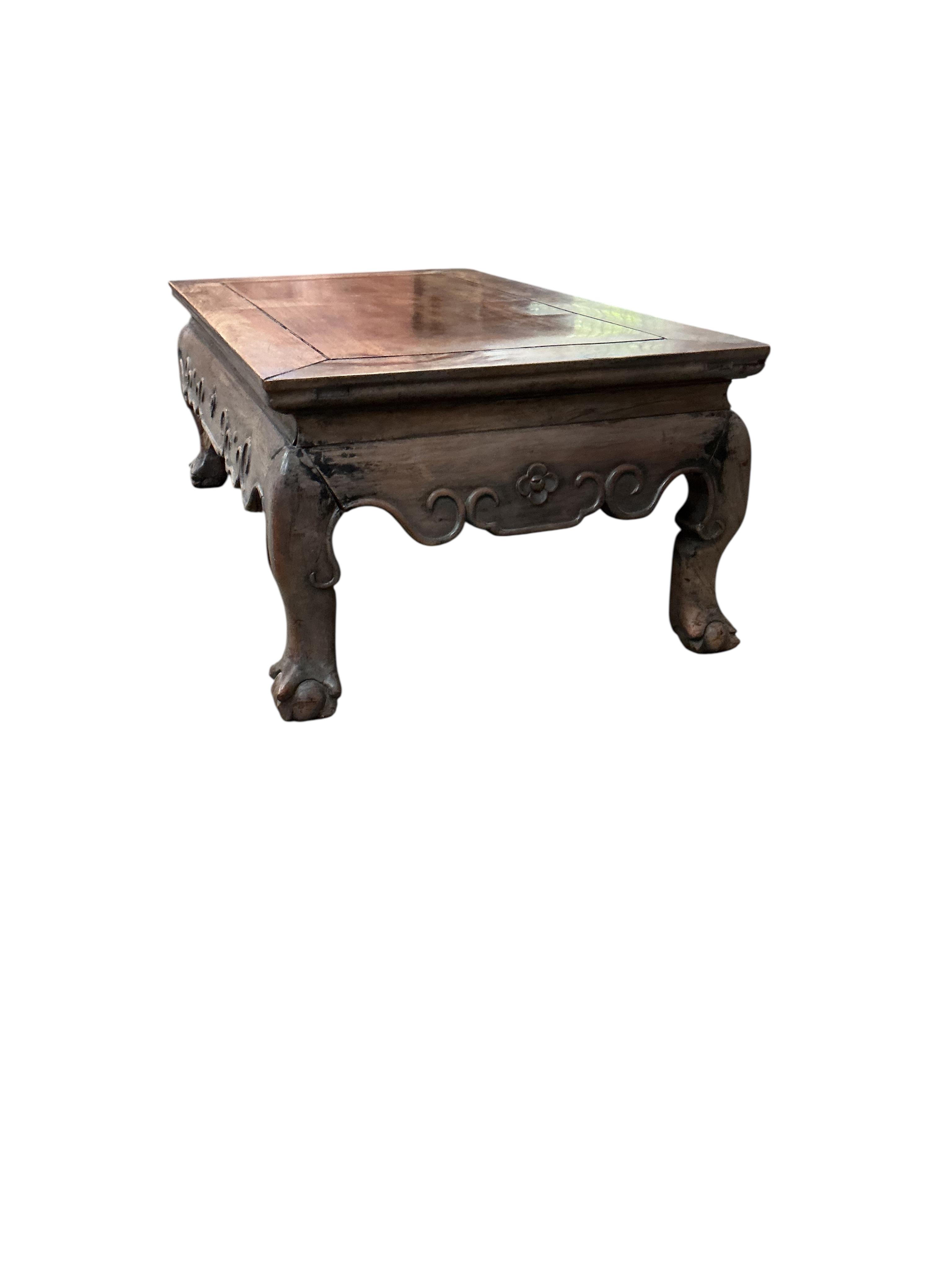 A Chinese rectangular hongmu low table, faded, width 77cm, depth 42cm, height 28cm